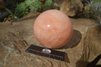 Polished Orange Twist Calcite Sphere x 1 From Maevantanana, Madagascar