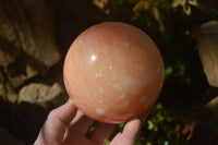 Polished Orange Twist Calcite Sphere x 1 From Maevantanana, Madagascar