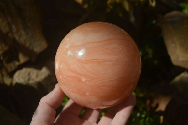 Polished Orange Twist Calcite Sphere x 1 From Maevantanana, Madagascar