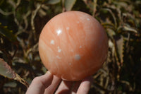 Polished Orange Twist Calcite Sphere x 1 From Maevantanana, Madagascar