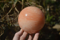 Polished Orange Twist Calcite Sphere x 1 From Maevantanana, Madagascar