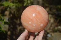 Polished Orange Twist Calcite Sphere x 1 From Maevantanana, Madagascar