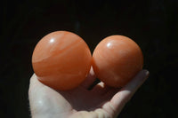 Polished Orange Twist Calcite Spheres x 3 From Maevantanana, Madagascar