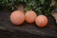 Polished Orange Twist Calcite Spheres x 3 From Maevantanana, Madagascar