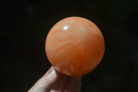 Polished Orange Twist Calcite Spheres x 3 From Maevantanana, Madagascar