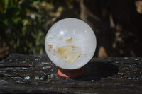 Polished Clear Quartz Ball With Limonite Veils x 1 From Madagascar