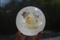 Polished Clear Quartz Ball With Limonite Veils x 1 From Madagascar