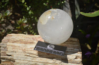 Polished Clear Quartz Ball With Limonite Veils x 1 From Madagascar