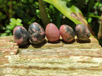 Polished Rhodonite Eggs x 35 From Ambindavato, Madagascar