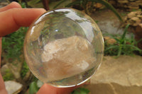 Polished Golden Rutile Quartz in PVC Resin Paperweight Spheres - sold per item - From Brazil