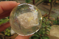 Polished Golden Rutile Quartz in PVC Resin Paperweight Spheres - sold per item - From Brazil