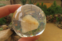 Polished Golden Rutile Quartz in PVC Resin Paperweight Spheres - sold per item - From Brazil