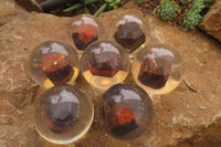 Polished Tiger Iron Jasper in PVC Resin Paperweight Spheres - sold per item - From Australia