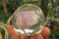 Polished Chevron Amethyst cobbed pieces in PVC Resin Paperweight Spheres - sold per item - From Zambia