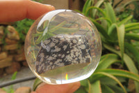 Polished Snowflake Obsidian pieces in PVC Resin Paperweight Spheres - sold per item - From Mexico