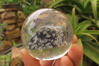 Polished Snowflake Obsidian pieces in PVC Resin Paperweight Spheres - sold per item - From Mexico