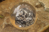 Polished Snowflake Obsidian pieces in PVC Resin Paperweight Spheres - sold per item - From Mexico