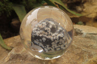 Polished Snowflake Obsidian pieces in PVC Resin Paperweight Spheres - sold per item - From Mexico