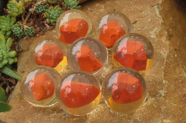 Polished Red Jasper cobbed piece in PVC Resin Paperweight Sphere - sold per item - From South Africa