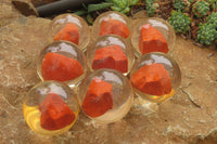 Polished Red Jasper cobbed piece in PVC Resin Paperweight Sphere - sold per item - From South Africa