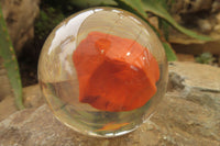 Polished Red Jasper cobbed piece in PVC Resin Paperweight Sphere - sold per item - From South Africa