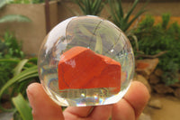 Polished Red Jasper cobbed piece in PVC Resin Paperweight Sphere - sold per item - From South Africa