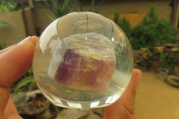 Polished Watermelon Fluorite cobbed piece in PVC Resin Paperweight Sphere - sold per item - From Namibia