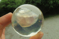 Polished Watermelon Fluorite cobbed piece in PVC Resin Paperweight Sphere - sold per item - From Namibia