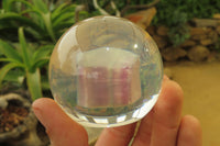 Polished Watermelon Fluorite cobbed piece in PVC Resin Paperweight Sphere - sold per item - From Namibia