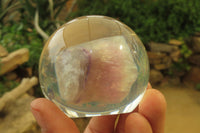 Polished Watermelon Fluorite cobbed piece in PVC Resin Paperweight Sphere - sold per item - From Namibia