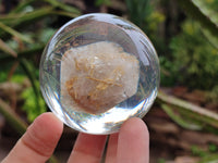 Polished Golden Rutile Quartz in PVC Resin Spheres - sold per item - From Brazil