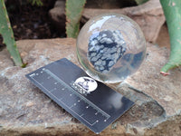 Polished Snowflake Obsidian pieces in PVC Resin Spheres - sold per item - From Mexico