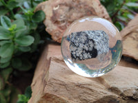 Polished Snowflake Obsidian pieces in PVC Resin Spheres - sold per item - From Mexico