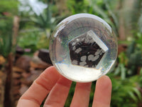 Polished Snowflake Obsidian pieces in PVC Resin Spheres - sold per item - From Mexico