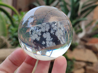 Polished Snowflake Obsidian pieces in PVC Resin Spheres - sold per item - From Mexico