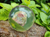 Polished Pink and Green Unakite cobbed piece in PVC Resin Sphere - sold per item - From South Africa