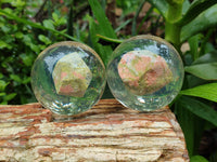 Polished Pink and Green Unakite cobbed piece in PVC Resin Sphere - sold per item - From South Africa