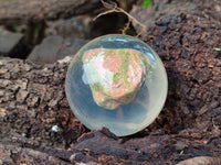 Polished Pink and Green Unakite cobbed piece in PVC Resin Sphere - sold per item - From South Africa