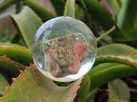 Polished Pink and Green Unakite cobbed piece in PVC Resin Sphere - sold per item - From South Africa