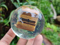 Polished Tigers Eye cobbed piece in PVC Resin Sphere - sold per item - From Northern Cape, South Africa