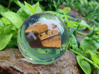 Polished Tigers Eye cobbed piece in PVC Resin Sphere - sold per item - From Northern Cape, South Africa