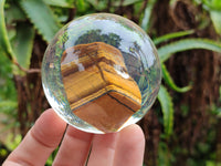 Polished Tigers Eye cobbed piece in PVC Resin Sphere - sold per item - From Northern Cape, South Africa