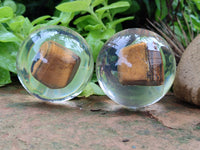 Polished Tigers Eye cobbed piece in PVC Resin Sphere - sold per item - From Northern Cape, South Africa