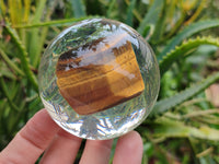 Polished Tigers Eye cobbed piece in PVC Resin Sphere - sold per item - From Northern Cape, South Africa