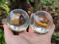 Polished Tigers Eye cobbed piece in PVC Resin Sphere - sold per item - From Northern Cape, South Africa