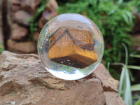 Polished Tigers Eye cobbed piece in PVC Resin Sphere - sold per item - From Northern Cape, South Africa