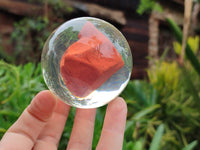 Polished Red Jasper cobbed piece in PVC Resin Sphere - sold per item - From South Africa