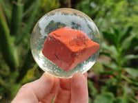 Polished Red Jasper cobbed piece in PVC Resin Sphere - sold per item - From South Africa