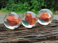 Polished Red Jasper cobbed piece in PVC Resin Sphere - sold per item - From South Africa