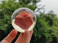 Polished Red Jasper cobbed piece in PVC Resin Sphere - sold per item - From South Africa